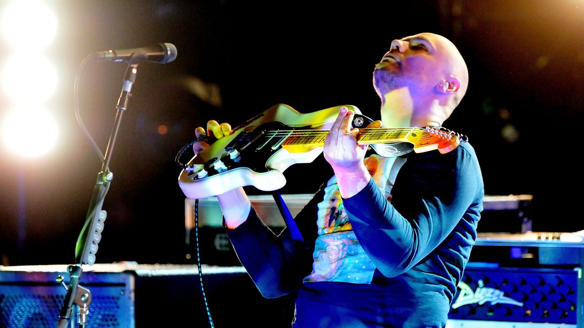 Billy Corgan holding a guitar