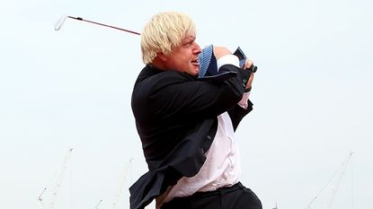 Boris Johnson swinging a golf club