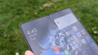 xiaomi mix fold 4 review images showing off the phone from multiple angles