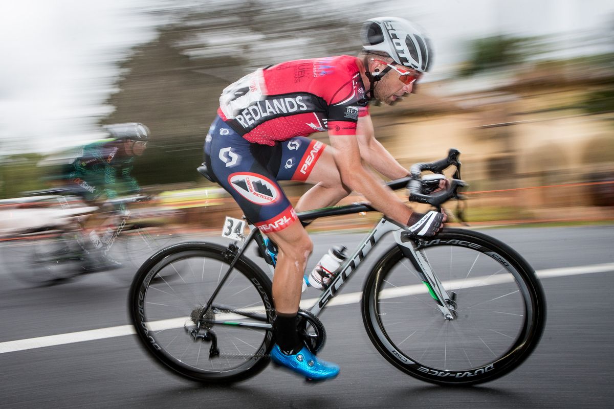 Kaler Marshall (Canyon) holds onto the climbers jersey.