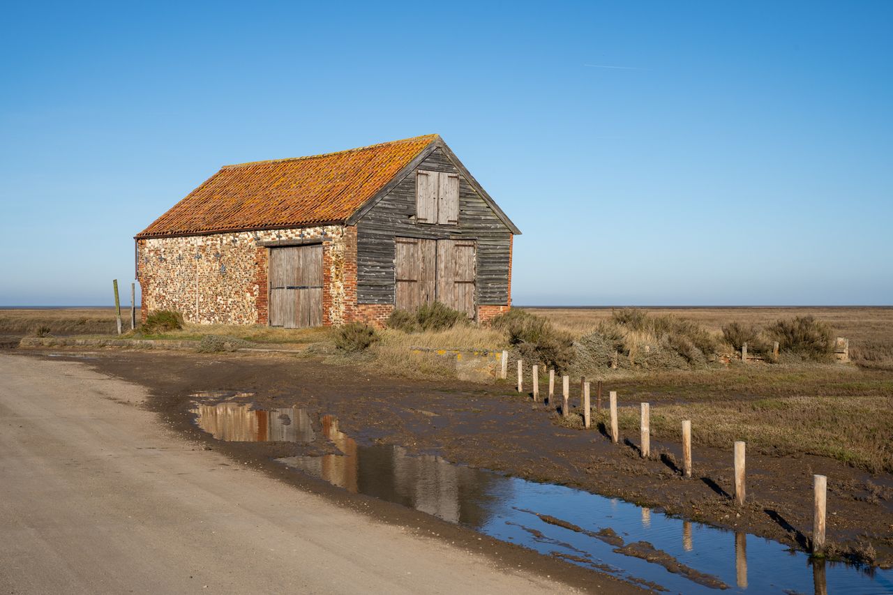 Sony FE 20-70mm F4 G lens sample image of barn with rusted roof