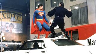 Christopher Reeve as Superman fighting a man on a car during one of the best superhero movies of all time, Superman 2.