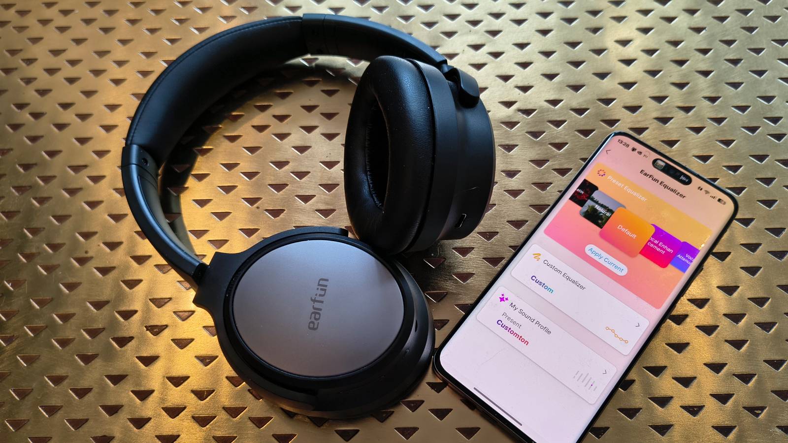The Earfun Tune Pro atop a bronze table.