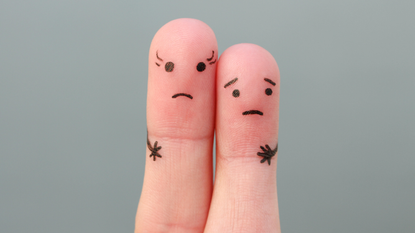 Fingers art concept of couple with taller woman.