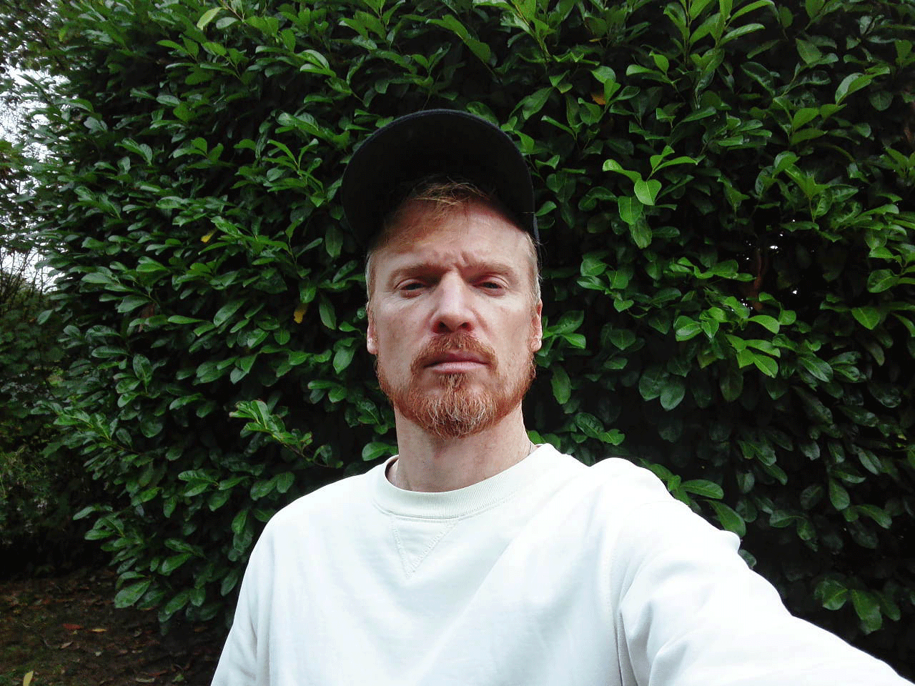 Fujifilm Instax Pal 2 sample gallery: gif of a man pulling baseball cap down over his face