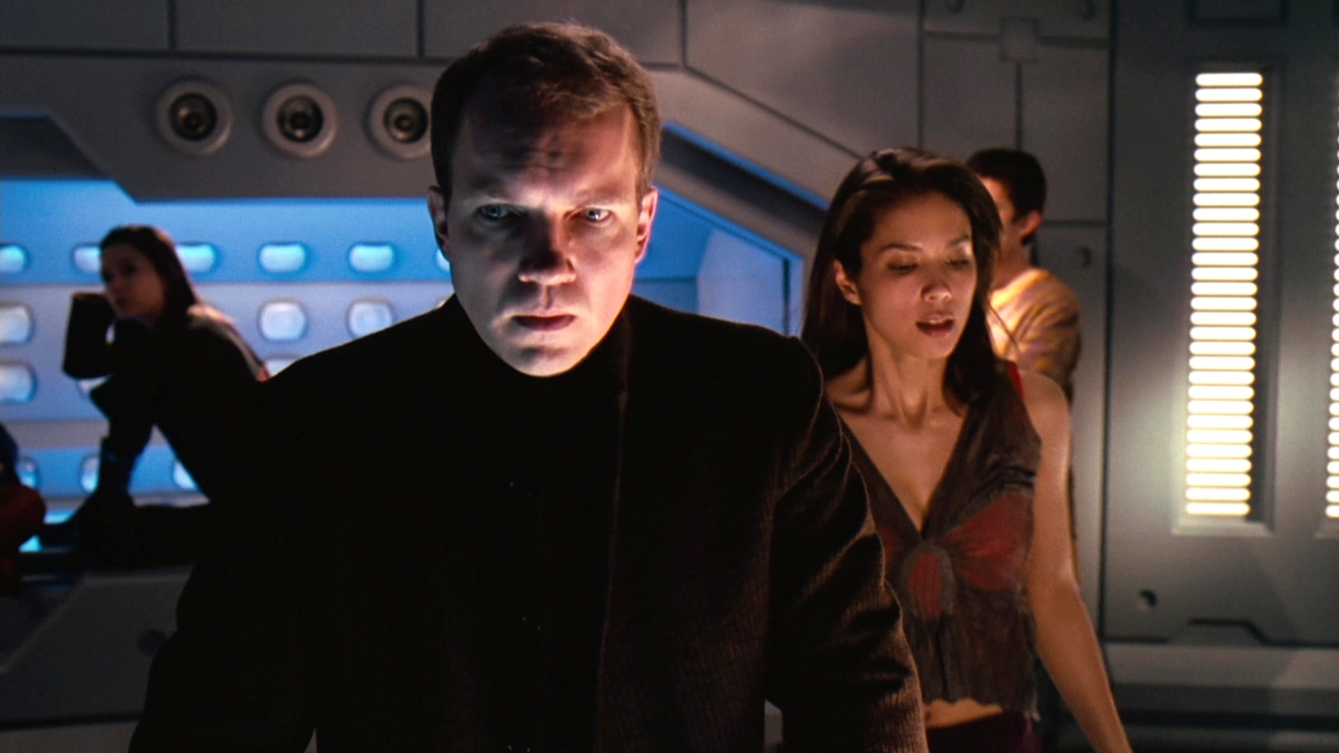 Screenshot from the 2001 space horror movie "Jason X" showing Chuck Campbell as Tsunaron Peyton and Lexa Doig as Rowan LaFontaine