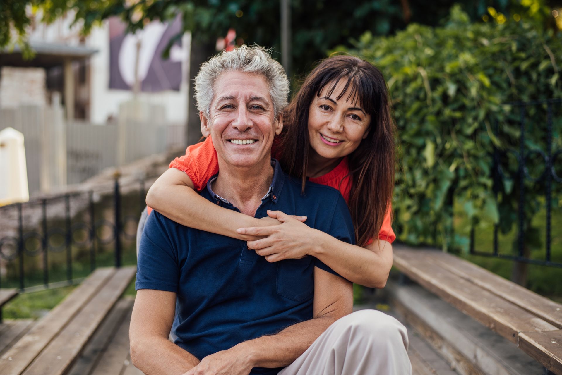 Portrait of the mature man and woman enjoying together in the park