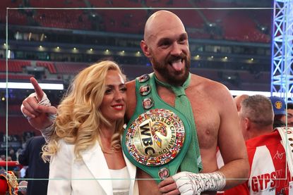Tyson Fury celebrates victory with his wife Paris Fury after the WBC World Heavyweight Title Fight between Tyson Fury and Dillian Whyte at Wembley Stadium on April 23, 2022