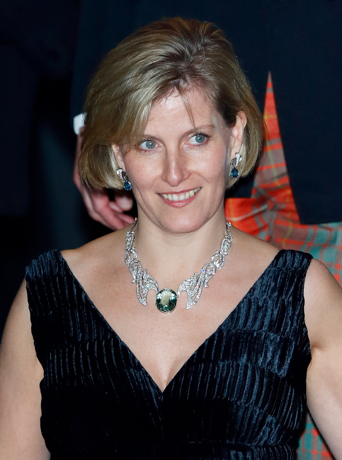 Duchess Sophie wearing a v-neck gown and diamond and aquamarine necklace