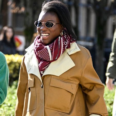 nikki ogunnaike wearing a brown coat