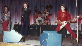 Glen Matlock, Johnny Rotten, Paul Cook, and Steve Jones performing live onstage at Dunstable's Queensway Hall.