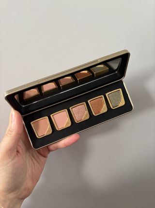 Mica Ricketts holding Hourglass Curator Eyeshadow palette