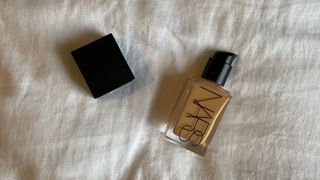 NARS Light Reflecting Foundation pictured on linen sheet background