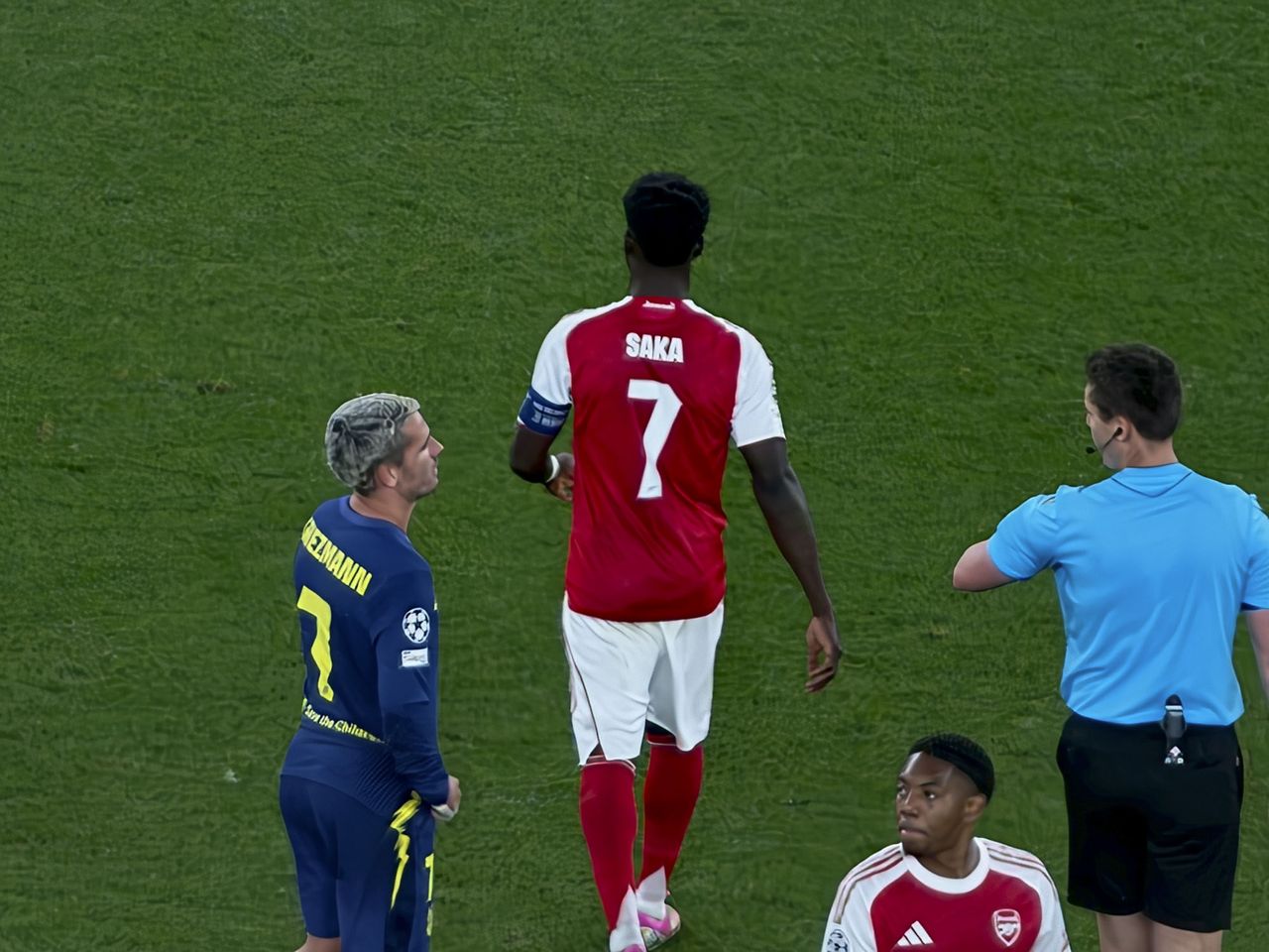 Action photos during a Champions League soccer match at Arsenal's Emirates stadium, taken with the Oppo Find X9 Ultra and teleconverter lens