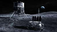 a cubic lunar lander on four legs sits on the dusty surface of the moon next to a small four-wheeled rover