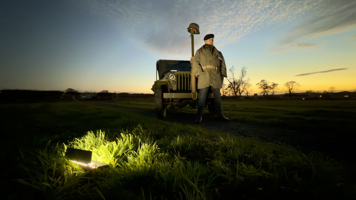 A man standing next to an old jeep at sunset lit by a Harlowe Blade 5 &amp; 10 LED Lighting Kit