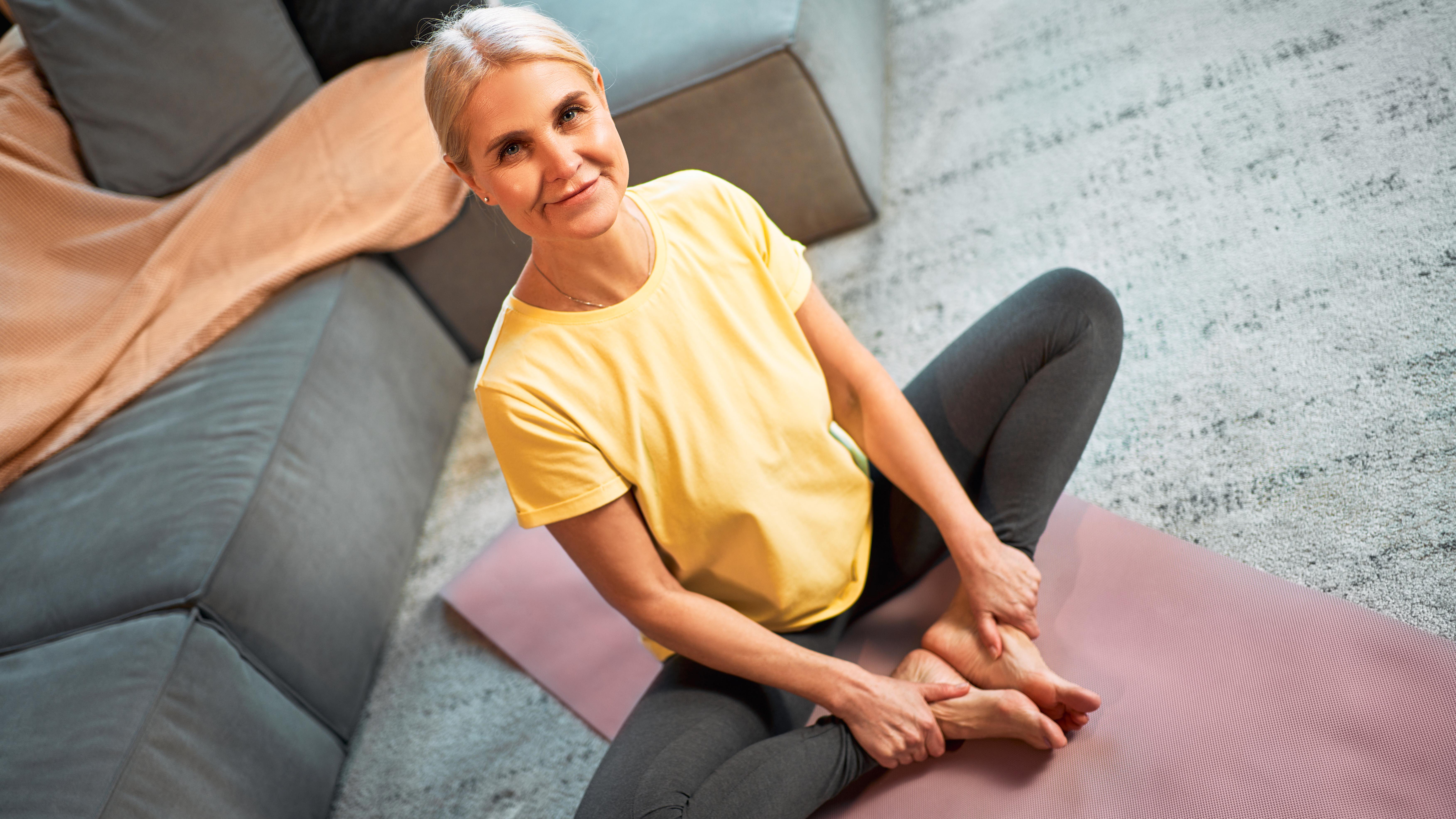a woman doing the seated butterfly stretch