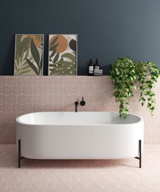 Pink and green bathroom scheme with pink honeycomb wall tiles and dark green contrast