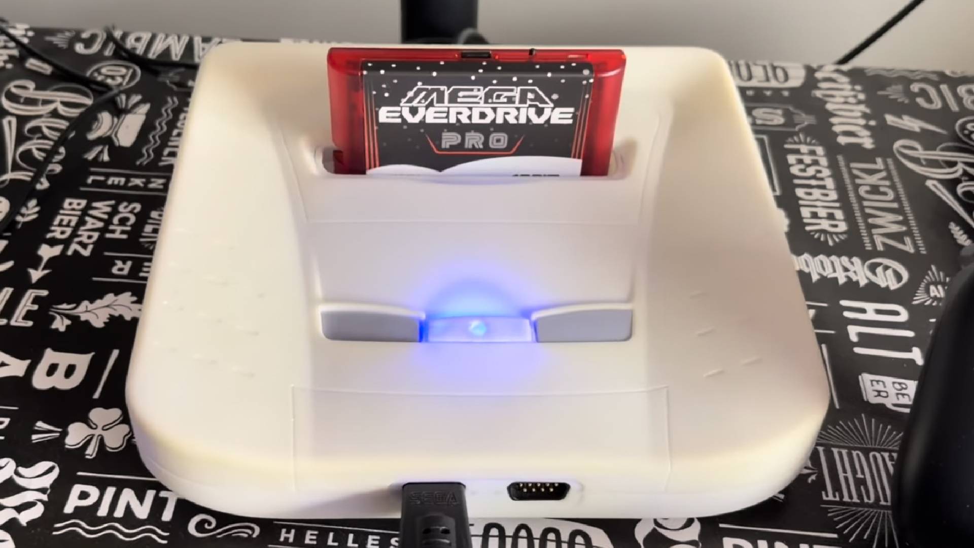White Sega Neptune FPGA console with Mega Everdrive cartridge in slot.