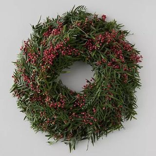 Green foliage and red berry wreath