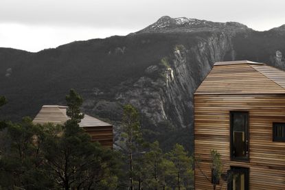 view of Bolder lodges in fjord in norway by snøhetta