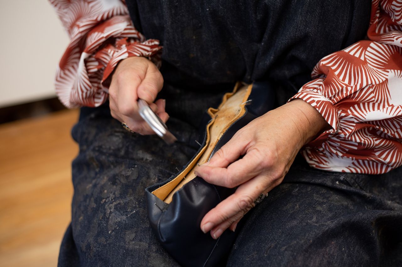 Woman's hands making a shoe