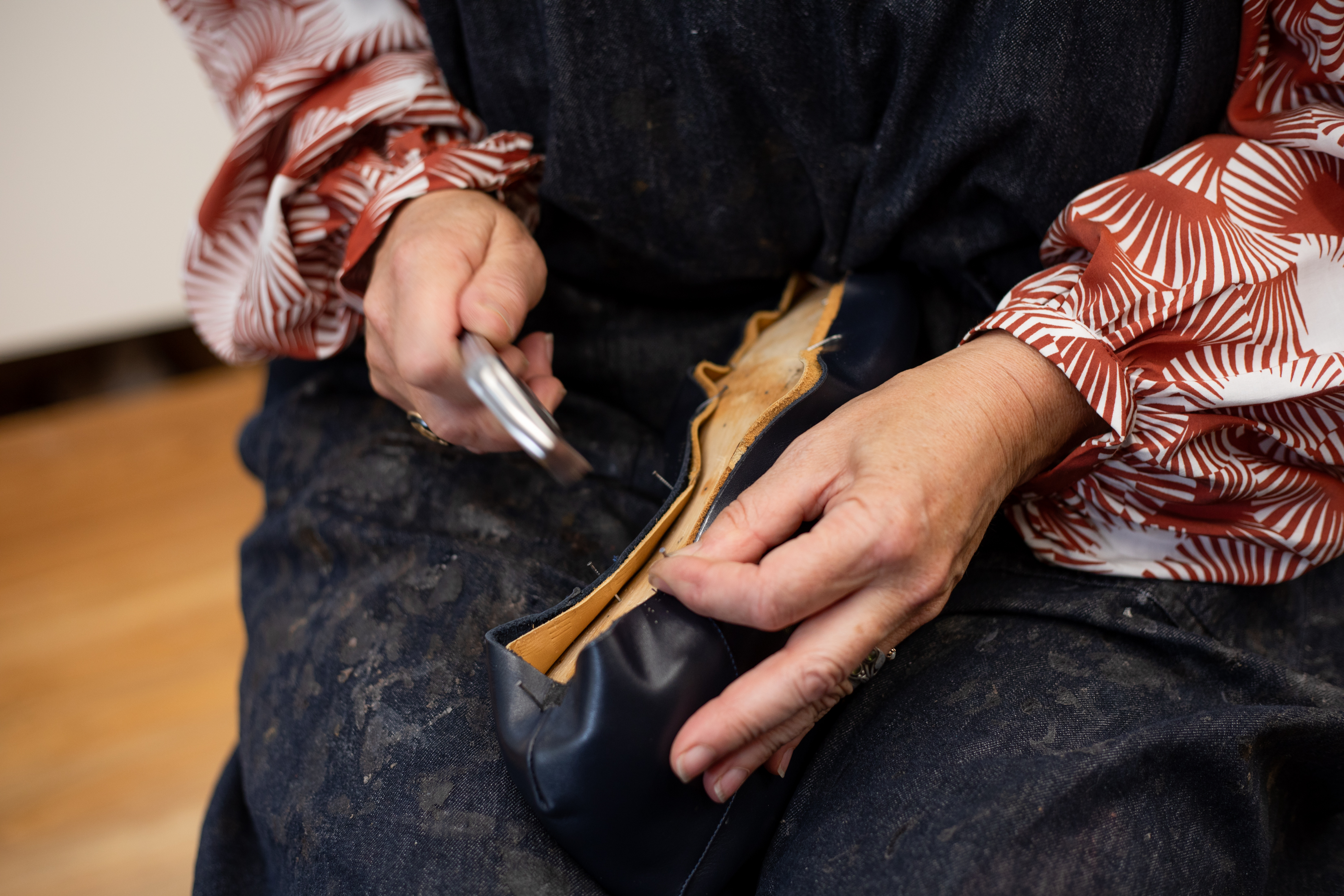 Woman's hands making a shoe