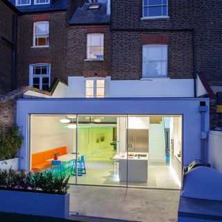 a modern single storey extension to a north London terraced home, with a large all-white kitchen diner inside