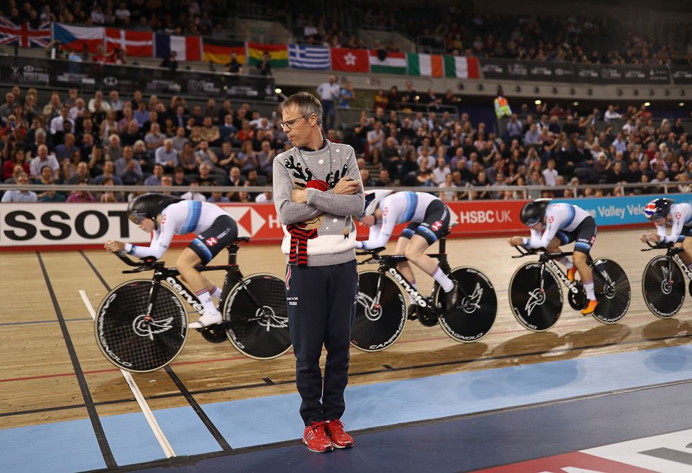 Paul Manning, Coach of Great Britain(C) looks on as the Great Britain Womens Team Pursuit Team make their way around the track during day One of the 2018 TISSOT UCI Track Cycling World Cup