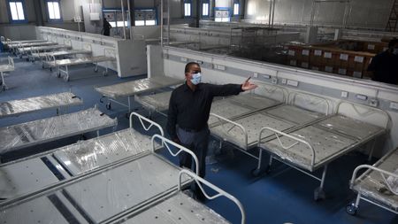 Beds being fitted in a temporary Covid-19 care centre in Mumbai, India