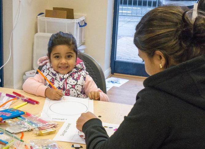 Parent and child thinking about science together.