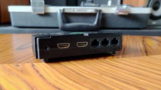 Eon XBHD adapter with dual HDMI ports and three ethernet connections facing camera