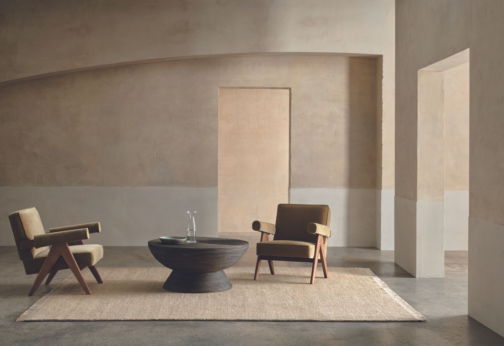 jute rug in a minimalist living room with two chairs