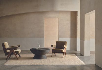 jute rug in a minimalist living room with two chairs