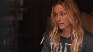 Piper Parabo sitting in a dining chair on Yellowstone