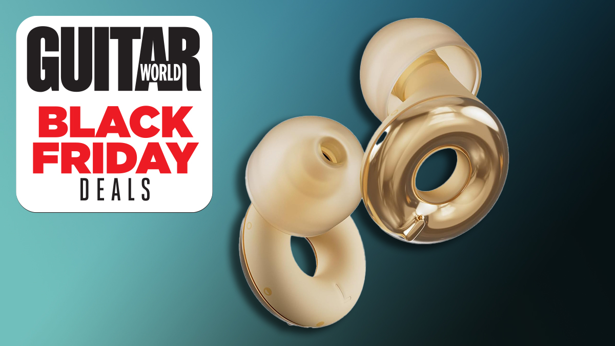 A pair of gold Loop earplugs against a dark blue background 