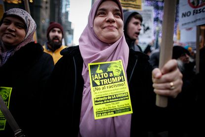 A Muslim woman protests outside Trump Tower.