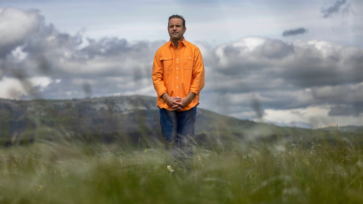 TJ Lavin standing outside in an orange shirt in The Challange: USA season 2