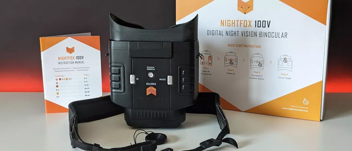 The Nighfox 100V with it&#039;s packaging and instruction manual on a black backdrop