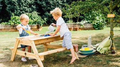 how to design a child friendly garden: plum play sand bench