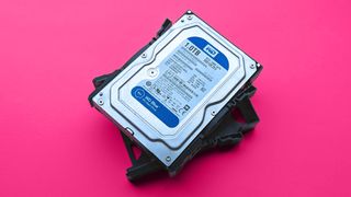 UGREEN NASync DH2300 on a magenta card paper background