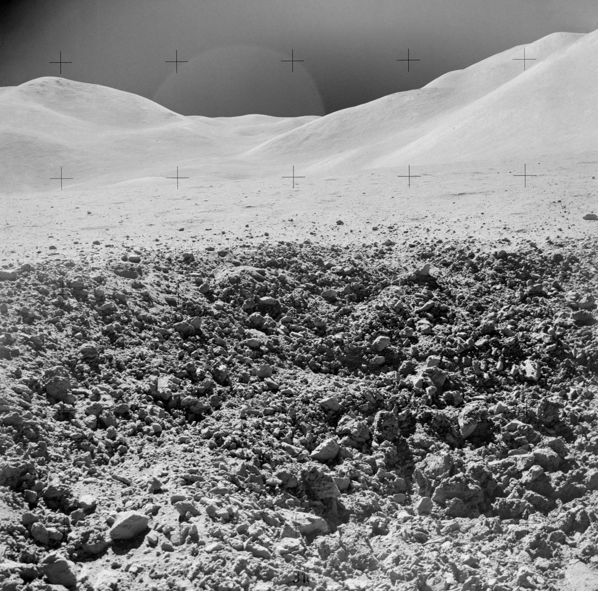 A close-up view of a portion of a &quot;relatively fresh&quot; crater, photographed by the Apollo 15 mission during a lunar surface extravehicular activity (EVA) on Aug. 2, 1971, near Scarp Crater.