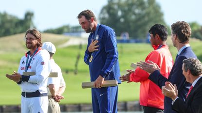 Scottie Scheffler emotional on the Olympic podium