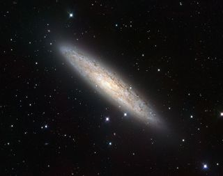 The European Southern Observatory's VLT Survey Telescope has captured the nearby spiral galaxy NGC 253 in sharp detail.