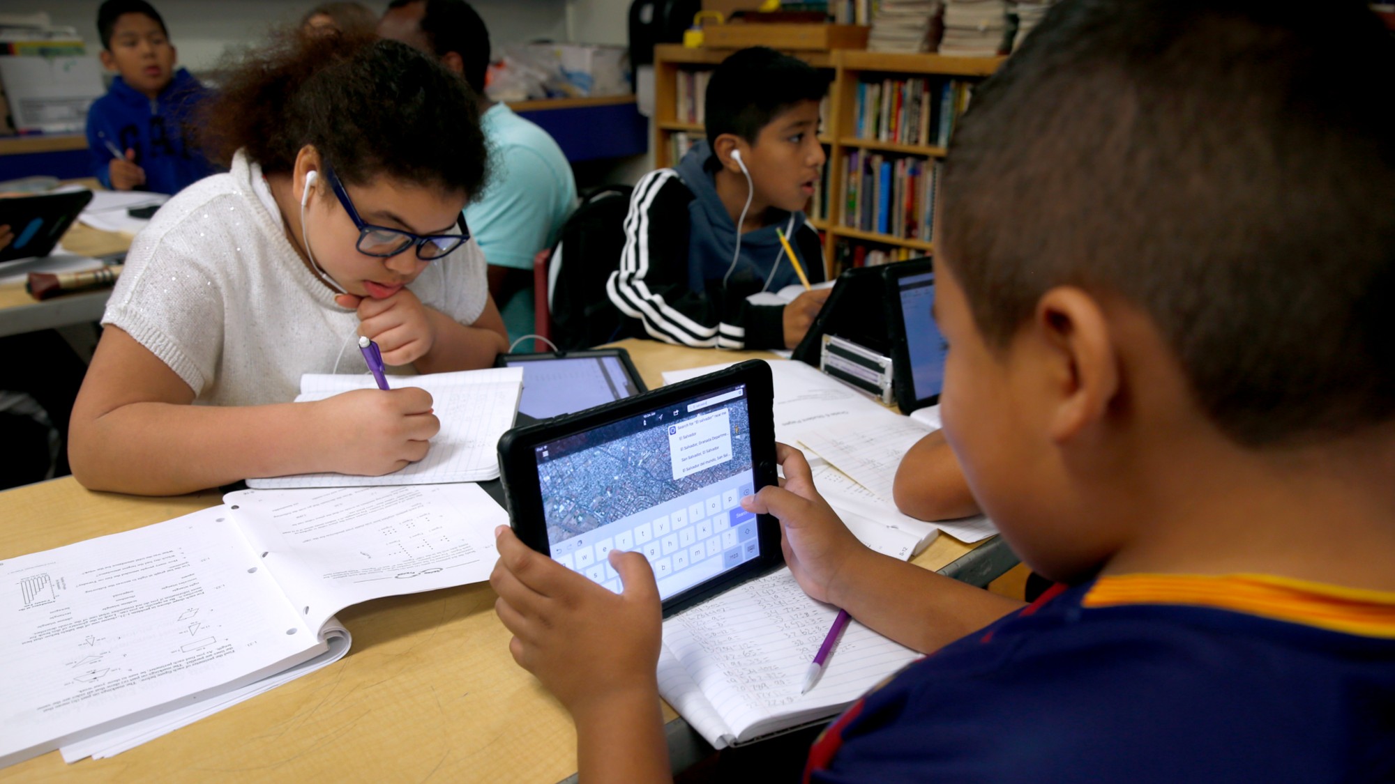 A student uses a tablet in a classroom in San Francisco.