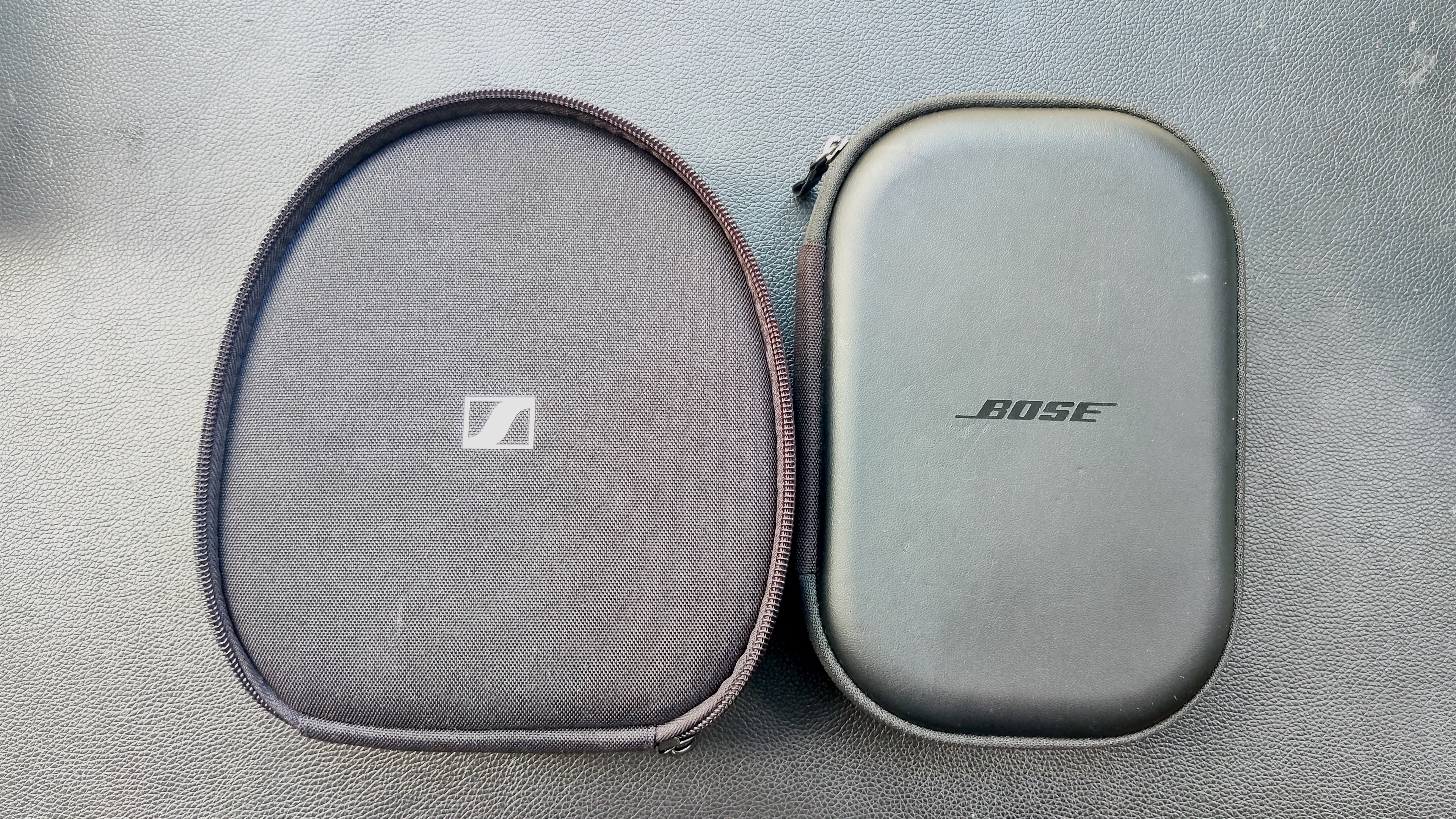 Pair of black headphones cases side by side