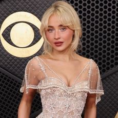 Sabrina Carpenter arrived at the 2026 Grammy Awards wearing a ruffled semi-sheer white gown