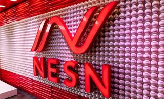 NESN logo on wall of baseballs in Fenway Park studio