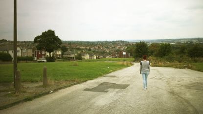 A woman walking down the road