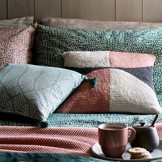 pom pom cushions and cup
